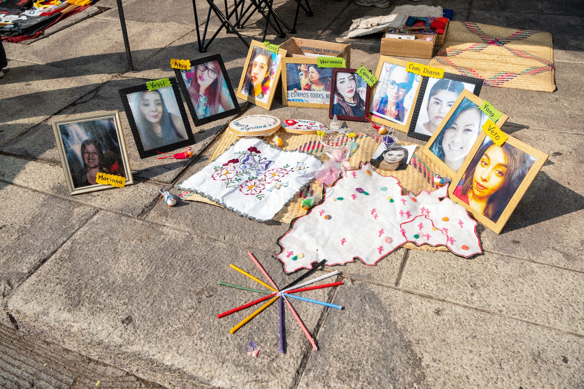 Memorial with photos of women killed by femicide displayed during the 8M march in Mexico City honoring victims of gender-based violence