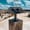Coin-operated binocular viewer at Göreme Panorama viewpoint with Cappadocia’s valleys in the background under a partly cloudy sky